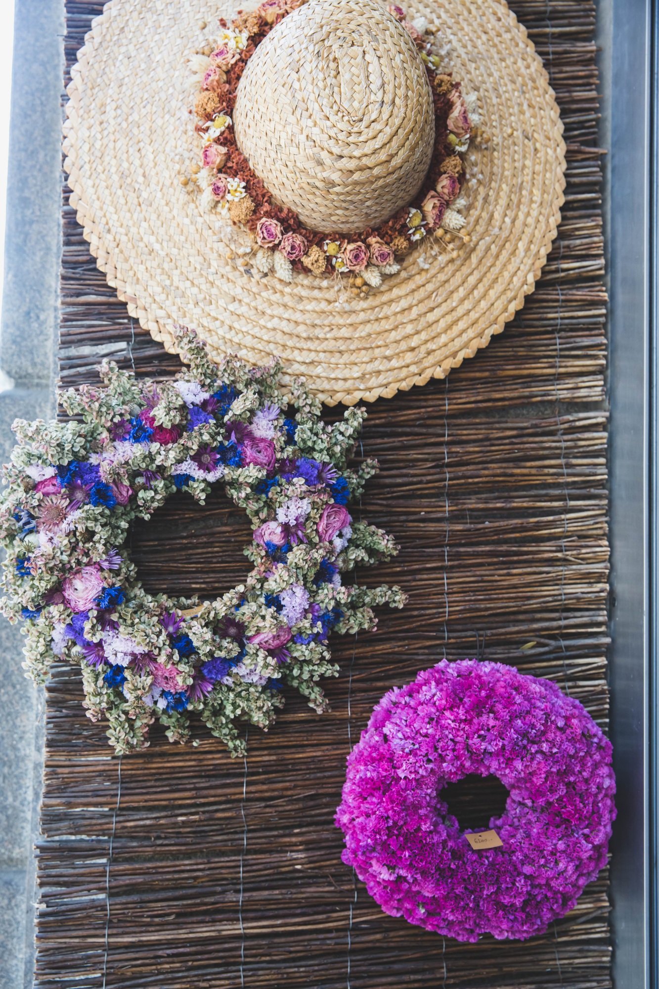 Spring wreaths of dried flowers at the decoration and flower shop